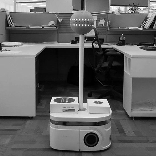 IAQ Robot conducting indoor air quality tests in an office setting.